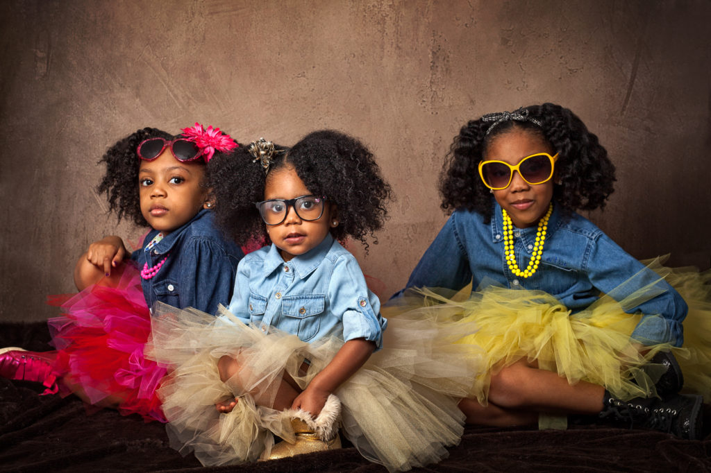 three sisters in tutus and sunglasses
