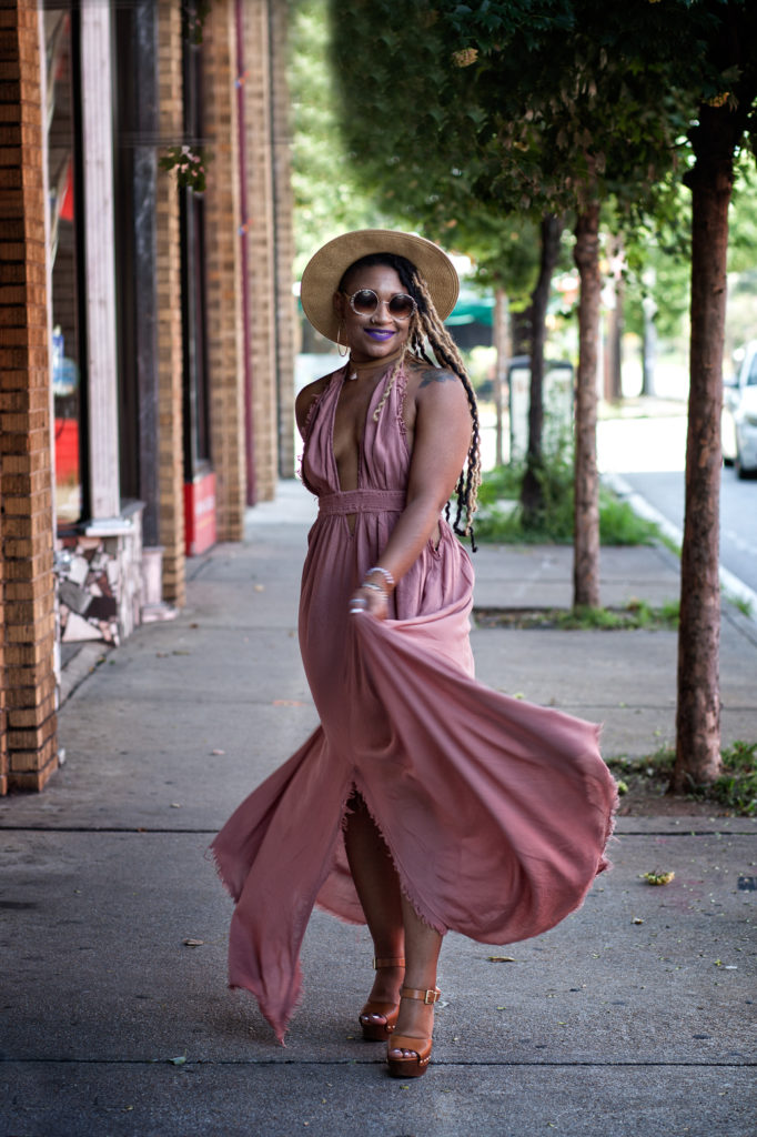 woman walking and twirling her dress