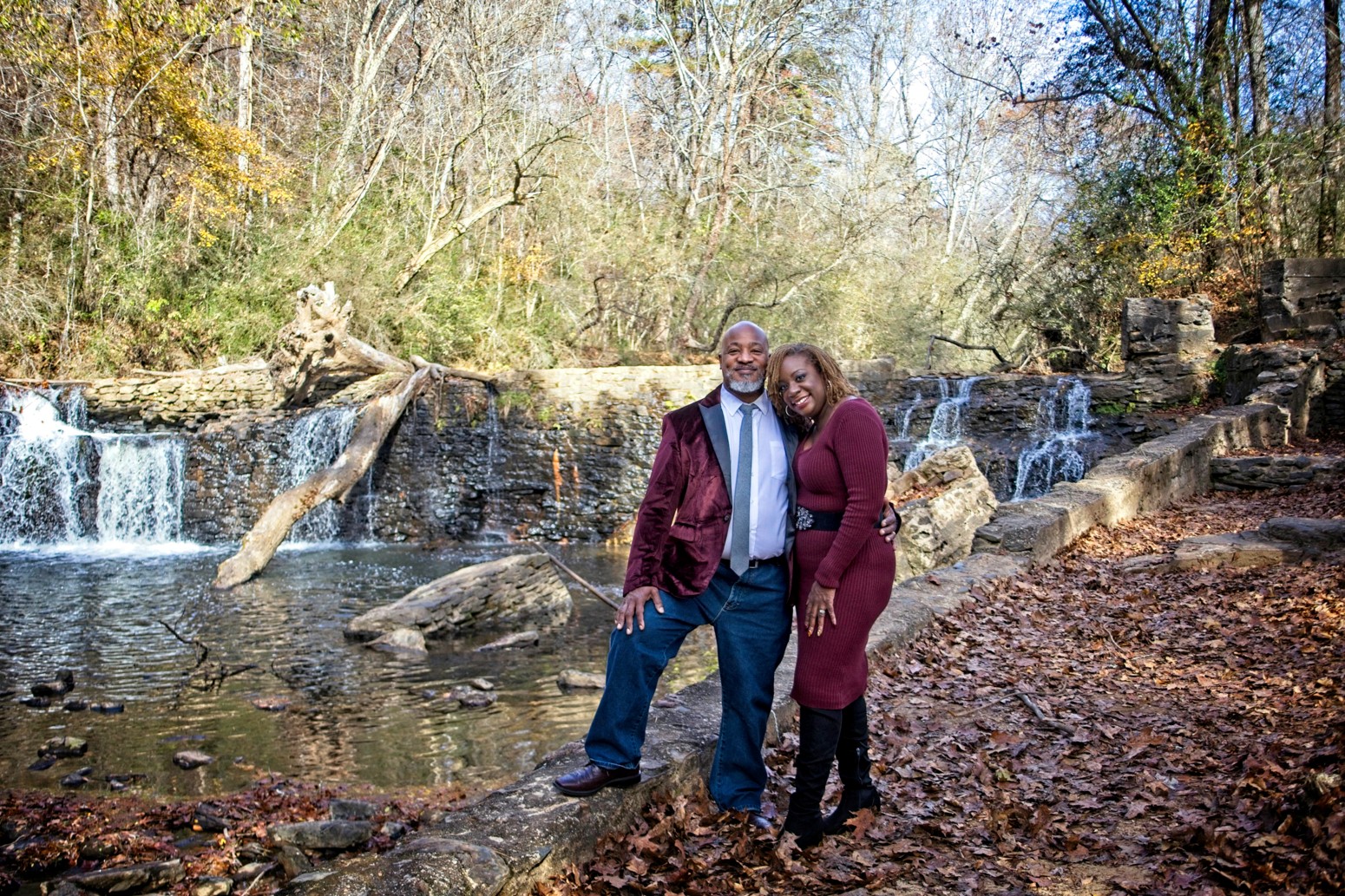 Portrait of married black couple near a waterfall